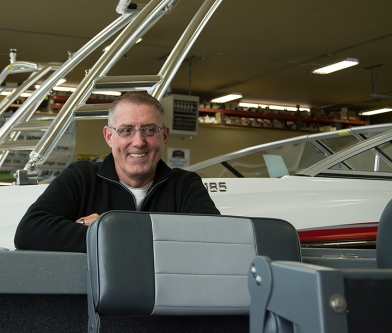 POCATELLO, Idaho — Ron, General Manager of Pocatello’s Park-A-Way RV & Marine Super Center talks with a customer about purchasing a boat on April 15,2015. (Photo by Missy M Turner)